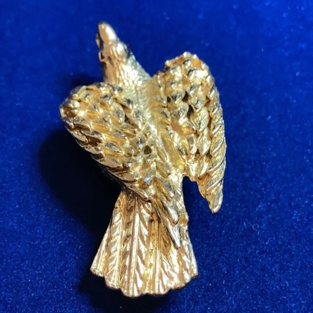 Vintage ‘60s gold tone Nesting eagle with red rhinestones